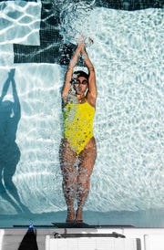 Woman doing a flip turn in swimming pool